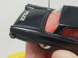 a small toy car that is being held by a person