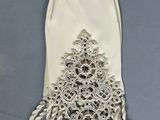 a picture of a white dress with a bow on it