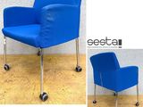 two pictures of a blue chair with wheels on a wooden floor