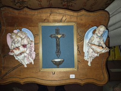 a picture of a picture of a crucifix with angels on it
