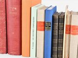 many books that are lined up on a shelf