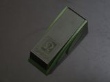 a green box that has a silver label on it