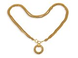 un collier en or avec un pendentif en forme de cercle au bout d'une chaîne