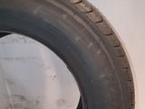 a close up of a tire on a white surface