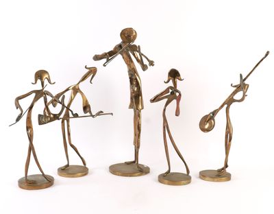 three bronze figurines of a man and a woman playing instruments