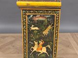 an image of a wooden box with a painting on it