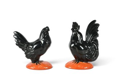 pair of black and orange rooster salt and pepper shakers