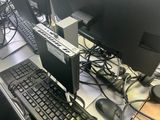 a computer desk with a keyboard, mouse, and monitor on it