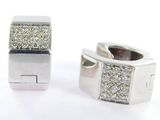pair of white gold and diamond earrings on a white background
