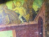 a painting on the wall of a room with a painting on it