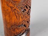 a wooden cup with a dragon design on it