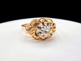 an image of a gold ring with a diamond in it
