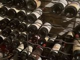 many bottles of wine that are sitting in a wine rack