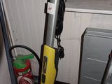 a vacuum that is sitting on the floor next to a window