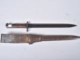 a knife and a knife holder on a white surface