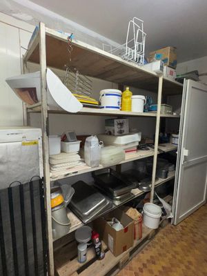 a room with a lot of items on the shelves