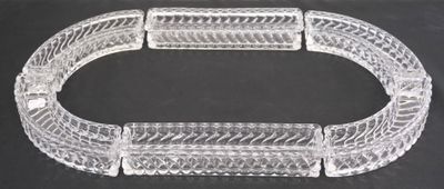 a close up of a clear glass bracelet on a black surface