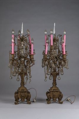 pair of antique brass candelabs with pink candles