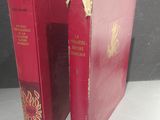 two red books that are sitting on a table