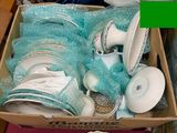 a box full of plates and bowls sitting on a table