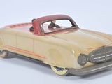 a toy car that is sitting on a white surface