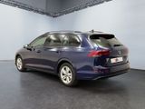 the back of a blue volkswagen suv parked in a garage