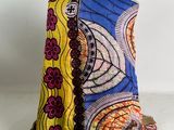 an image of a colorful cloth bag sitting on top of a white surface