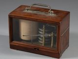 a small wooden box with a clock inside of it