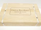 a wooden box with a label on it that says chateau hau - bally grand cru classe