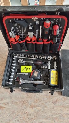 a tool case with tools in it sitting on the floor
