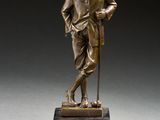 une image représentant une statue en bronze d'un homme muni d'une canne