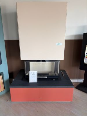 a stove that is sitting in the middle of a room