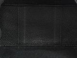 the inside of a black leather purse with a zipper on it