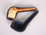 a picture of a brooch of a duck with a pipe in its mouth
