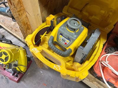 a yellow box with a yellow and gray toy in it