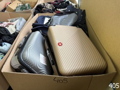 a box full of luggage sitting on the floor in a room