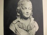 an old black and white photo of a bust of a woman