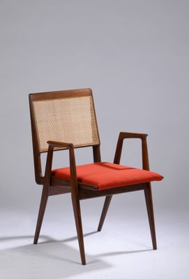 an image of a chair with a red cushion and a wooden frame