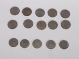 a close up of a bunch of coins on a white surface