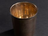 silver cup on a black background