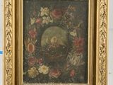 tableau représentant un oiseau dans un nid, entouré de fleurs, dans un cadre doré