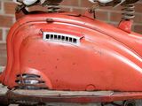a red scooter with two lights on top of it