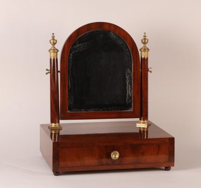 an antique wooden vanity mirror with a mirror on top of it