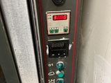 an image of a metal oven with buttons on it