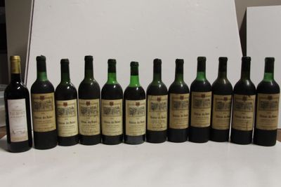 several bottles of wine are lined up in a row on a table