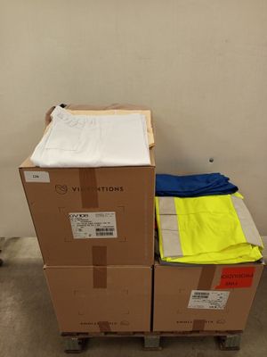 boxes stacked on top of each other in a room next to a wall