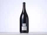 a bottle of wine that is sitting on a table