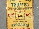 a sign on the side of a building that says comestibles and truffes