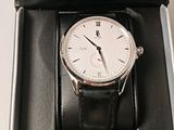 a watch that is in a box on the table