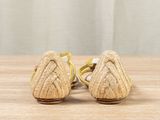 a close up of a pair of women ' s shoes on a table